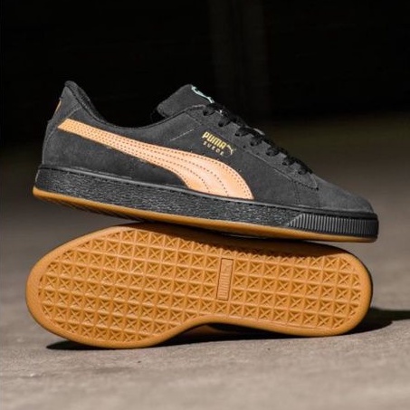 black suede pumas with brown sole