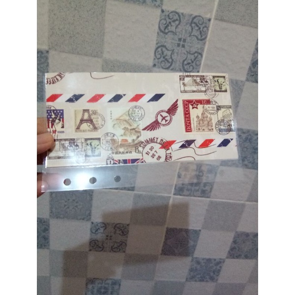 

Amplop Laminating A6 dan 6 lubang motif Perangko