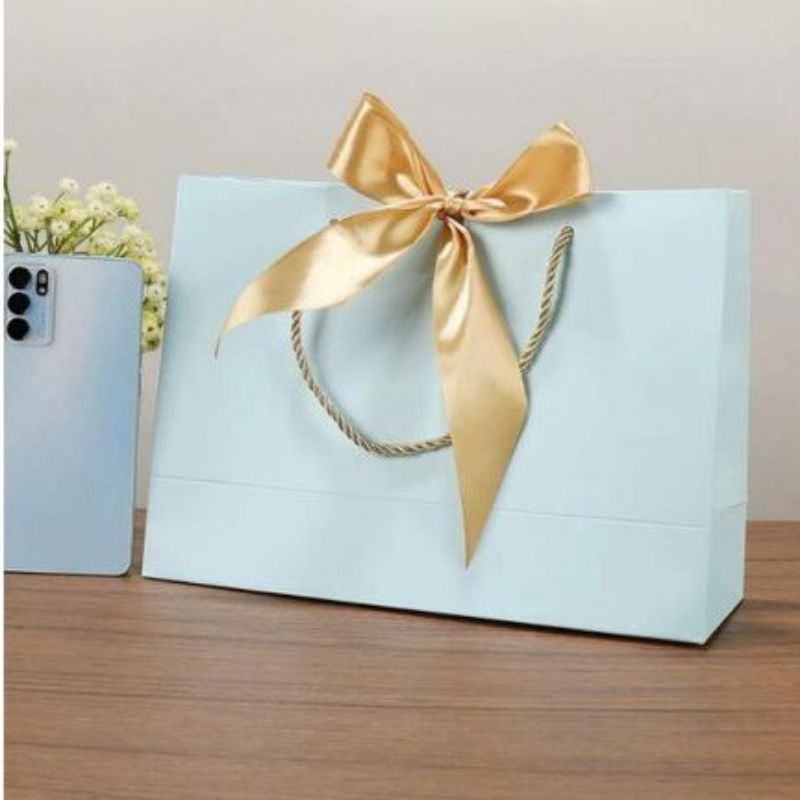 

PREMIUM PAPERBAG SOFT BLUE " TURQUOISE " GOLD RIBBON.22X10X22 cm.