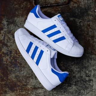 white and navy blue adidas superstar