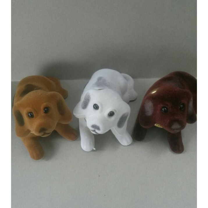 boneka anjing kepala goyang dashboard mobil