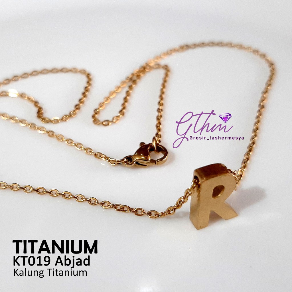 kalung TITANIUM abjad nagita Kecil simpel mewah seperti emas asli anti karat kt019