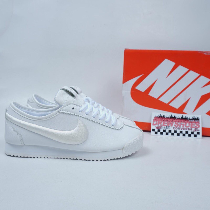 all white cortez womens
