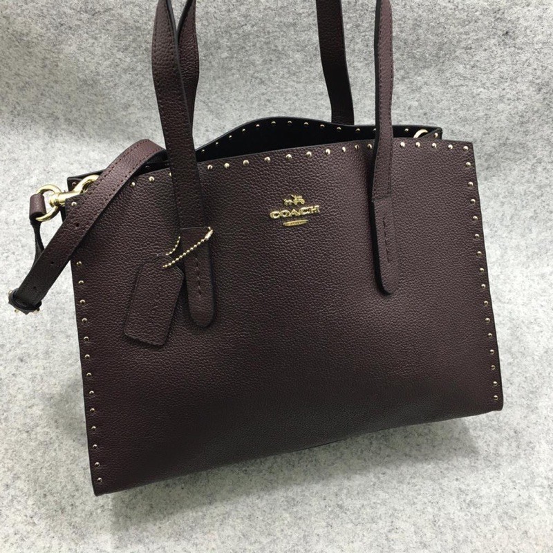 Tas Tote COACH Charlie Carryall Oxblood Rivets