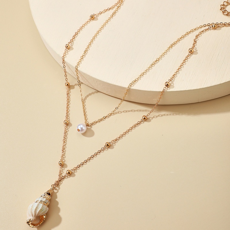 Kalung Rantai Emas Multilayer Aksen Mutiara Keong Geometris Kecil