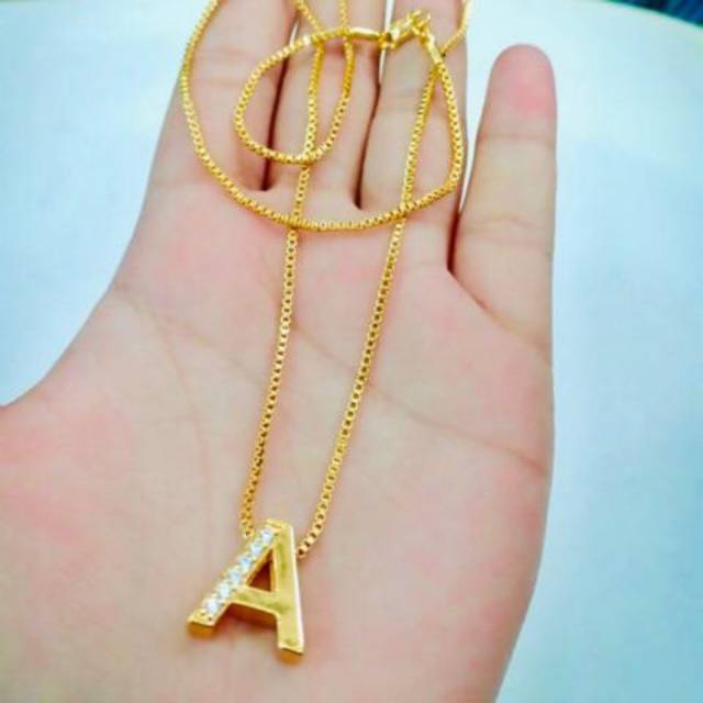 kalung titanium kacang viral