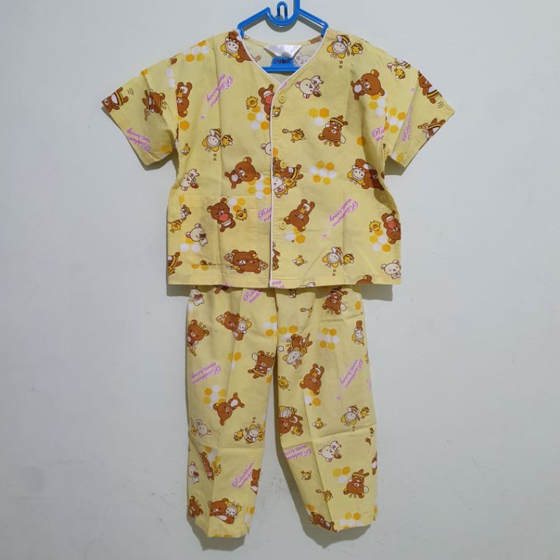 Preloved Baju Tidur NiQta Rilakkuma yellow size 1-2y