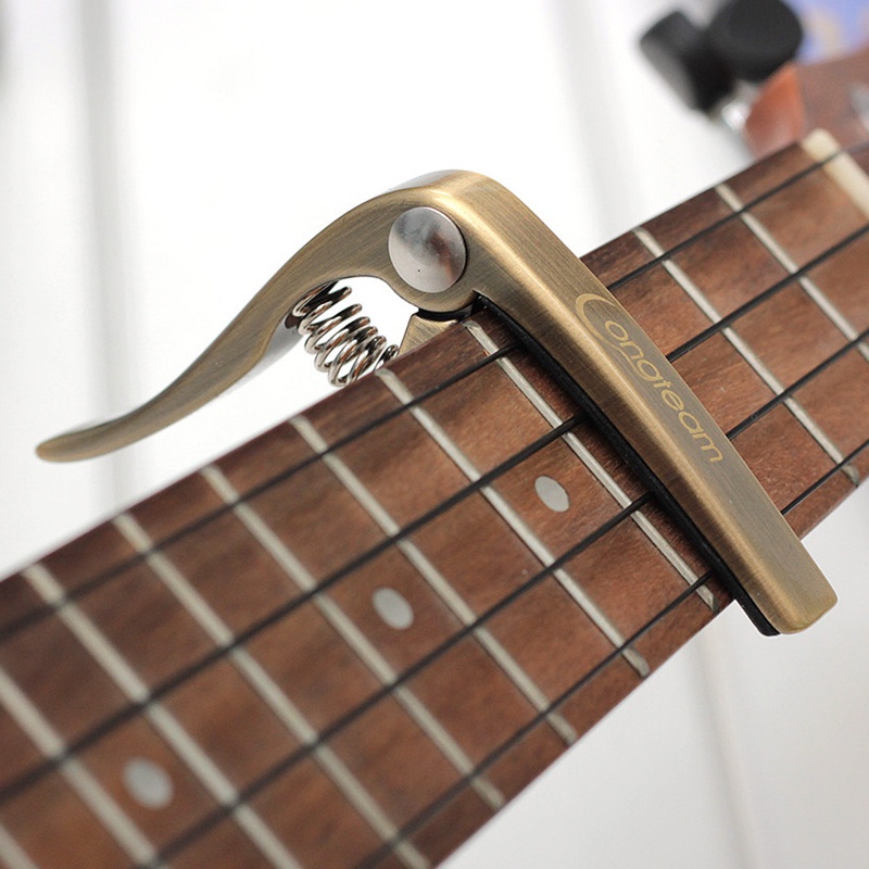 Capo Ukulele Bahan Zinc Alloy 3 Warna Dengan Bantalan Silikon