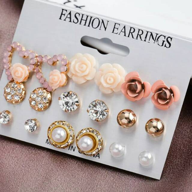 1 pasang anting tindik giwang emas imitasi