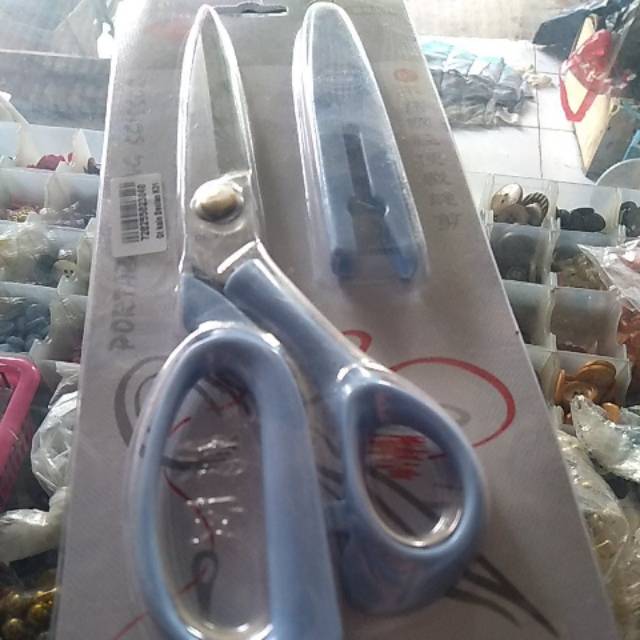 

Gunting bahan tutup