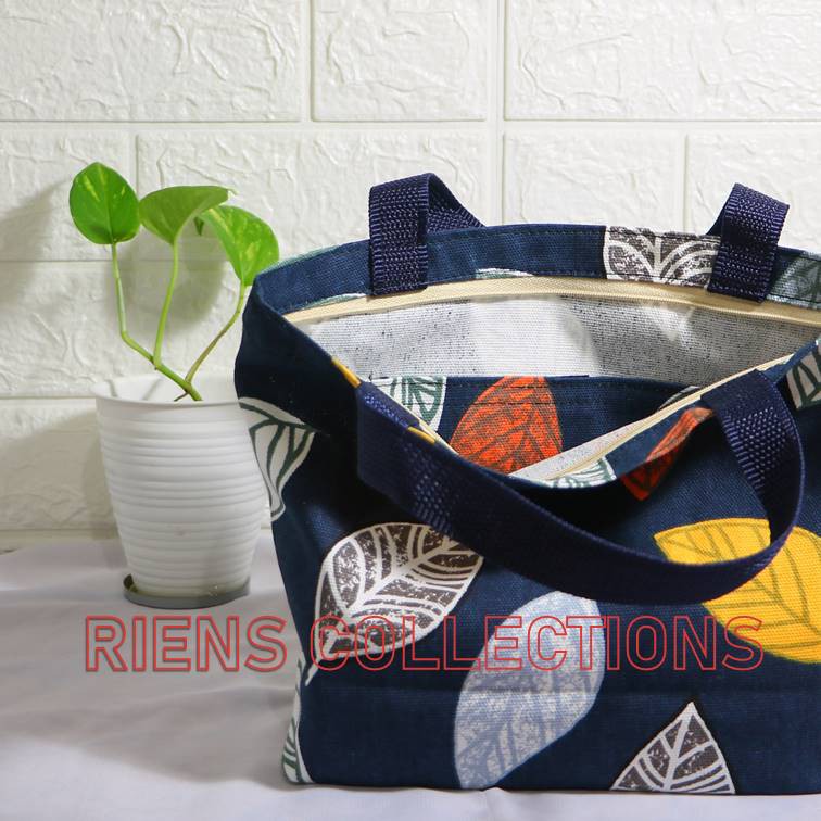 RIENS COLLECTIONS. HANDBAG KECIL BAHAN KANVAS MOTIF DAUN NANGKA BIRU