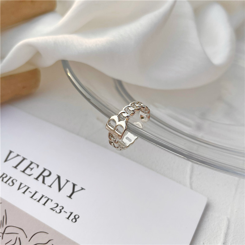 Cincin Model Terbuka Adjustable Desain Huruf B Hollow Out Bahan Alloy Warna Silver Untuk Wanita