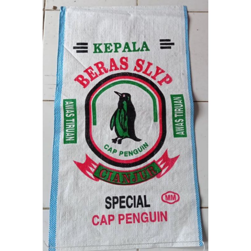 

karung beras pinguin polos/putih susu 20kg(ini kemasan bukan beras )