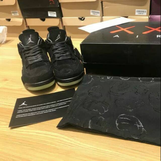 NIKE Air Jordan 4 Retro x KAWS Black Clear GID (Glow In the Dark)