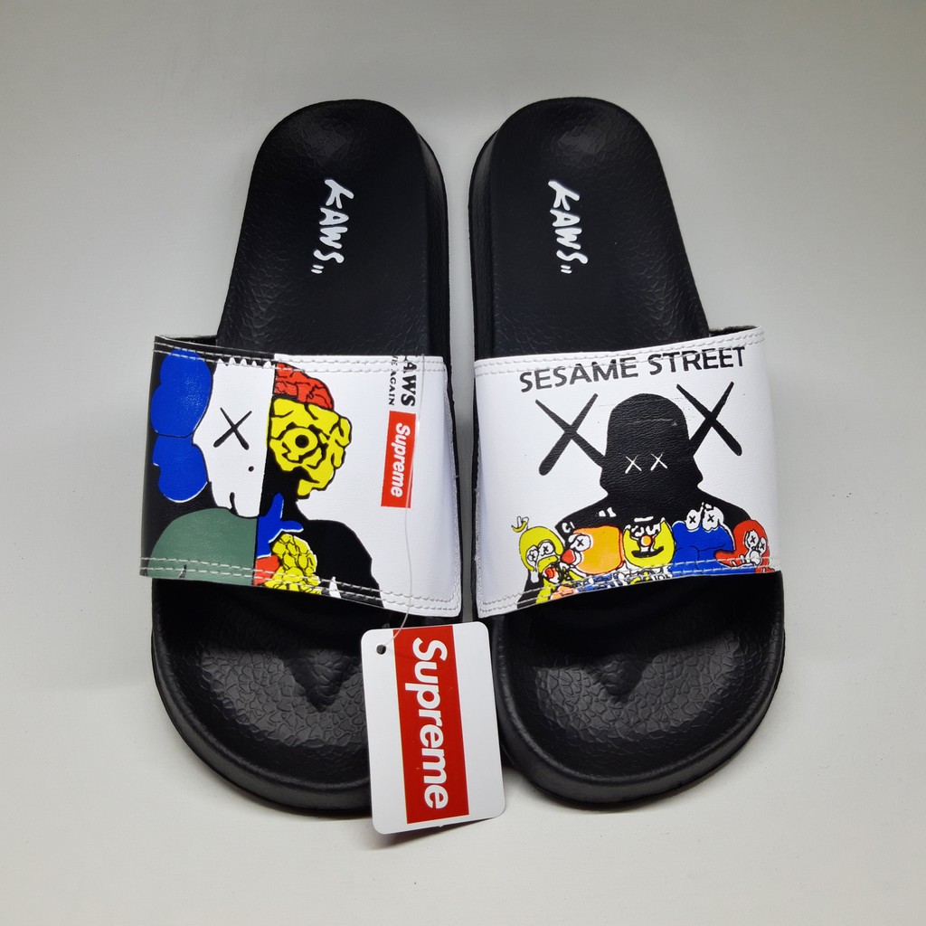 SANDAL PRIA KAWS X SUPREME SESAME STREET SENDAL SLOP PRIA SLIDE