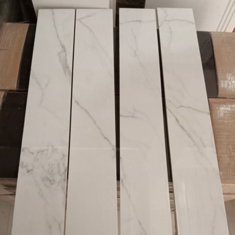 Lis / plint granit 10x60 putih corak