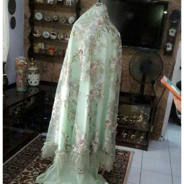 Mukena bunga timbul plus tas.