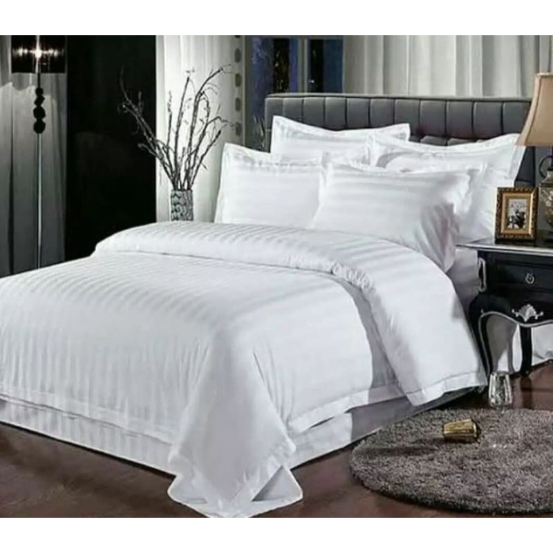 Sprei putih motif hotel