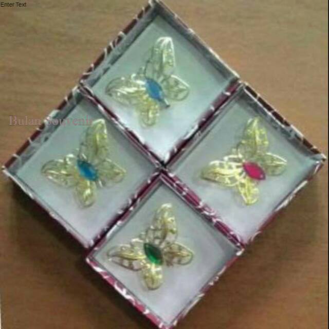 Souvenir bros kupu-kupu emas