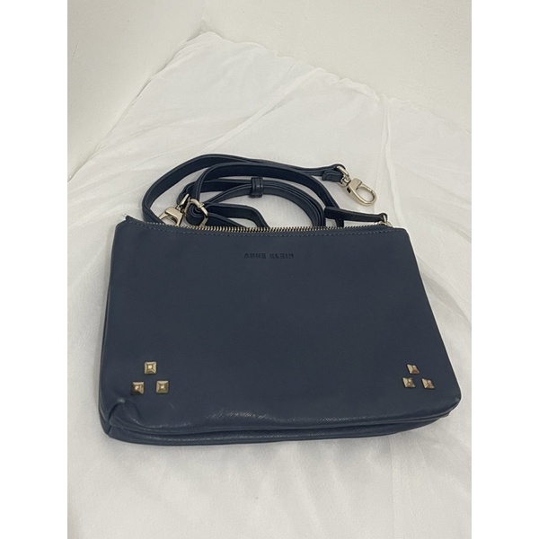 SLING CLUTCH ANNE KLEIN