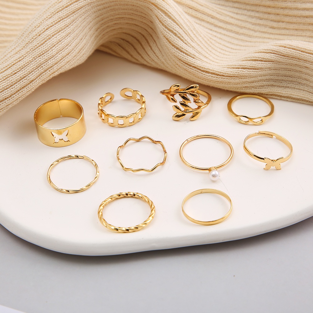 10pcs / Set Cincin Model Kupu-Kupu Hollow Warna Emas Aksen Mutiara Gaya Vintage Untuk Wanita