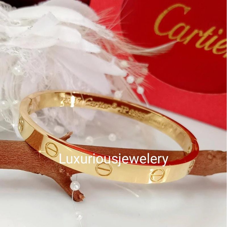 Gelang bangle tittanium ada grafir logo