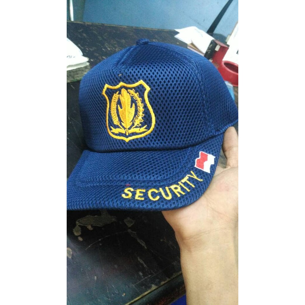topi security biru logo kuning
