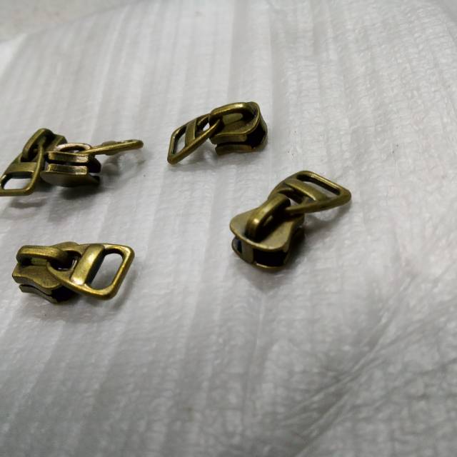 Kepala sleting u/ gigi metal besi dan gigi vislon jaket. 100 pcs