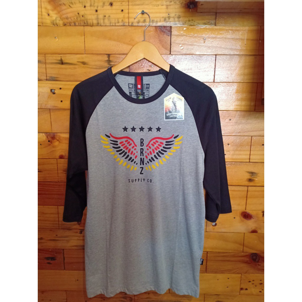 KAOS REGLAN BRONZE DISTRO