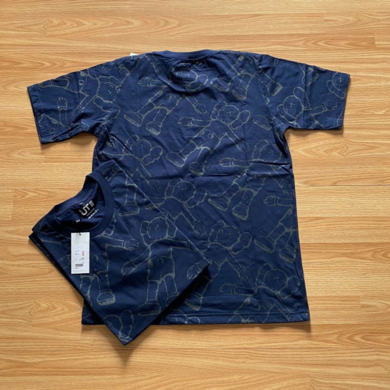 KAOS DISTRO PRIA UNIQLO X KAWS FULL PRINT NAVY PREMIUM
