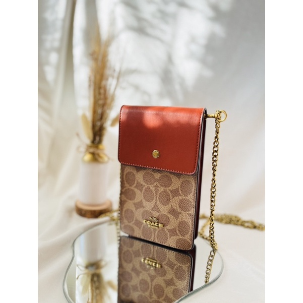 coach phone bag in signature