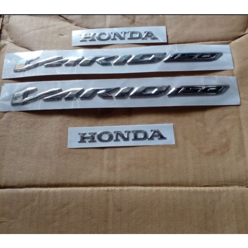 EMBLEM VARIO TIMBUL 125 150 ORIGINAL