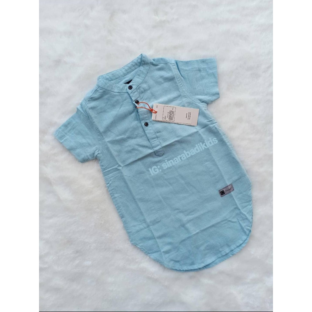 Kemeja Koko Anak Lengan Pendek Sepaha warna Biru Muda Kemeja Koko Anak Lengan Pendek Sepaha warna Biru Muda