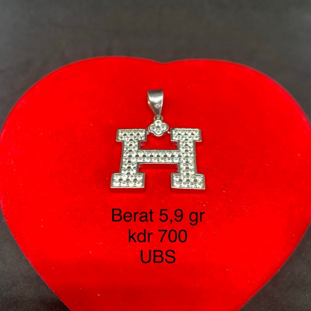 Liontin emas putih kadar 750 model hermes bermata