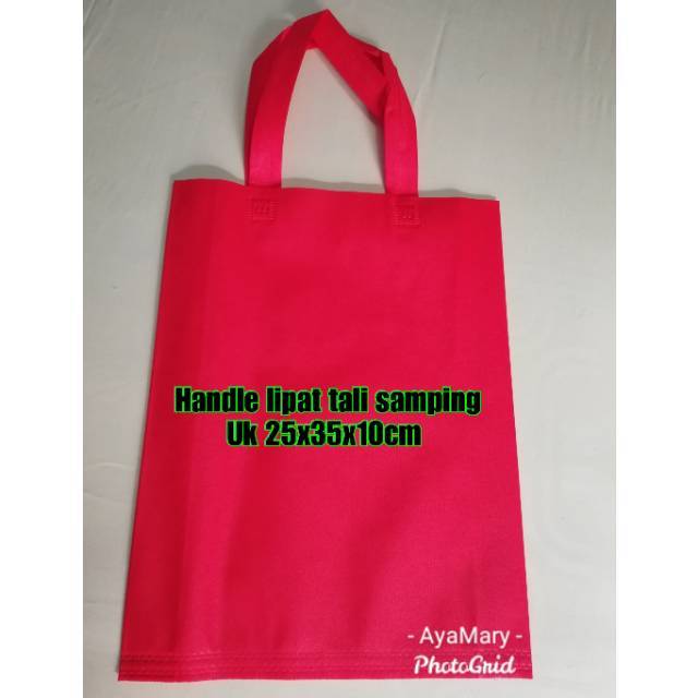 

Tas Spunbond uk 25x35x10cm goodiebag handle tali