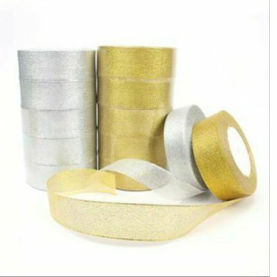 

Pita Metalik Gold /silver dengan Dua Sisi lapisan glitter.Uk.40 mm x 18 M harga/roll(1.1/2)