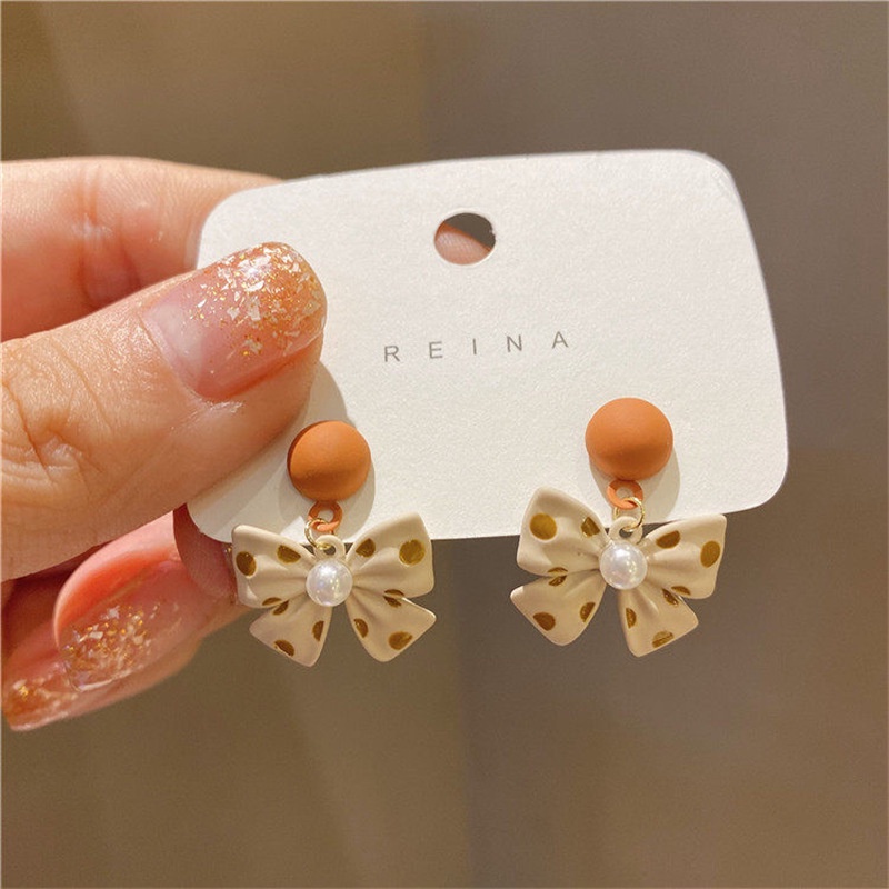 Anting Bentuk Pita Motif Polkadot Aksen Mutiara Untuk Wanita