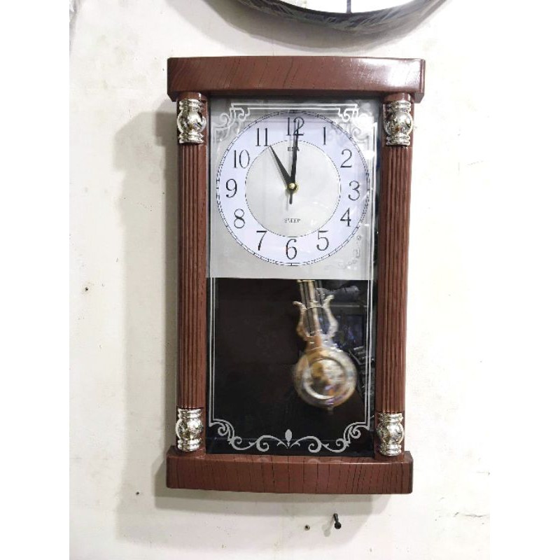 Jam Dinding ESA Mesin Quartz Motif Kayu Musik Sama Bandul Goyang