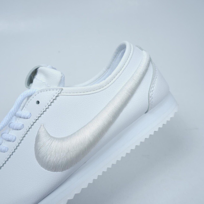 all white cortez womens