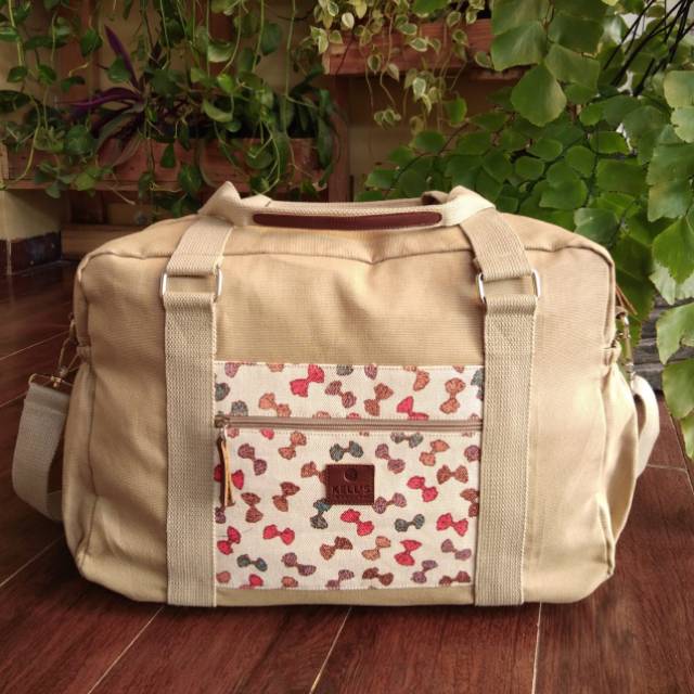 Tas travel cream mix motif pita by. Kell's Marllon
