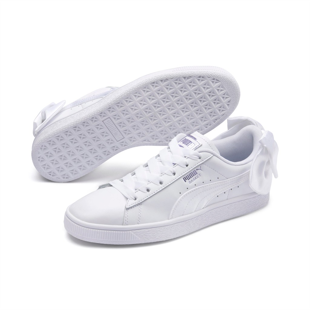 white puma with bow