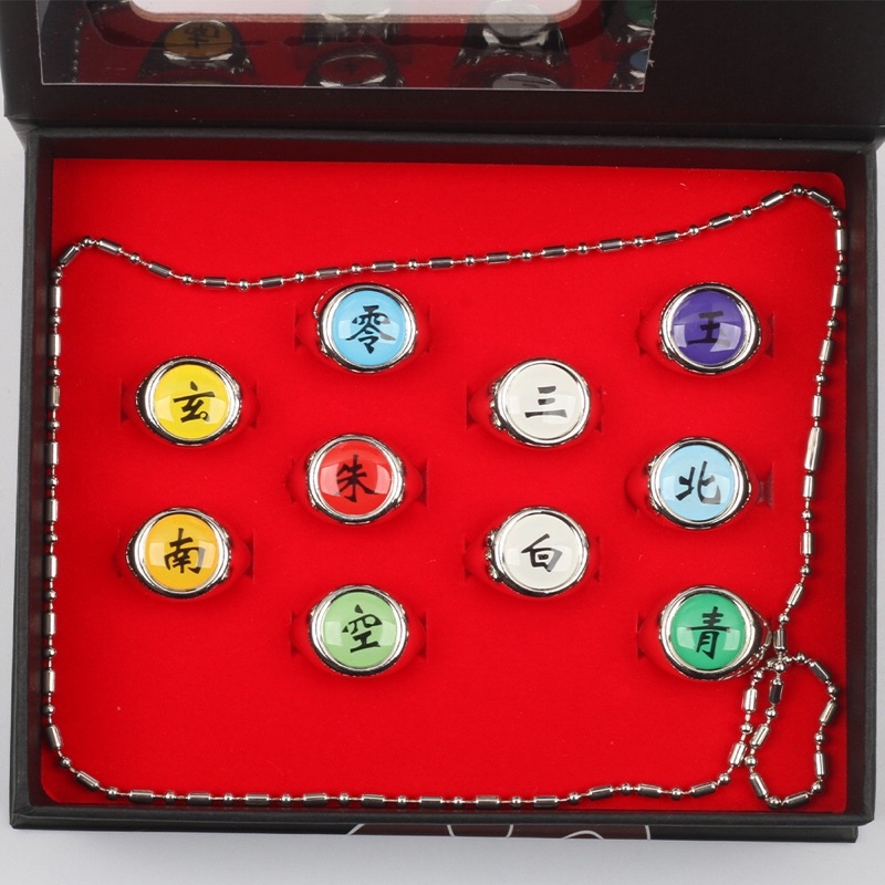 SET BOX 10PCS CINCIN IMPORT ANIME NARUTO ITACHI AKATSUKI ALL TEAM COSPLAY