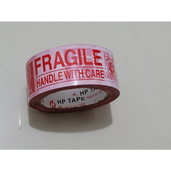 

lakban fragile merah putih Merk HP TAPE 45mm x 100 yard 2 in 1 Flash Sale