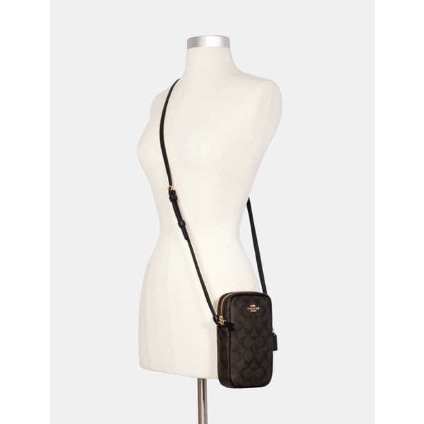coach north south zip phone crossbody brown black