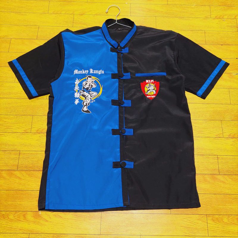 Cod.Hem43 ATASAN IKS.PI KERA SAKTI BIRU HITAM.BAJU SILAT