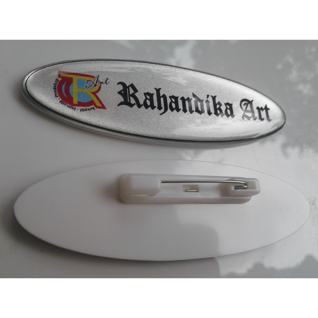 

Name Tage Papan Nama Dada Akrilik Oval Lapis Glass Peniti