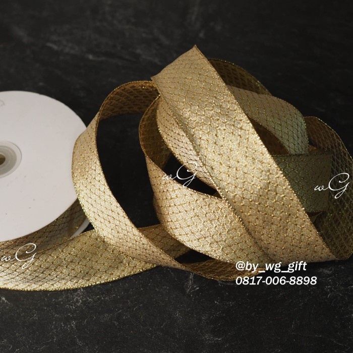 

Pita Kain Gold Motif; Lebar 3.8 Cm; Panjang 25 Yard 036