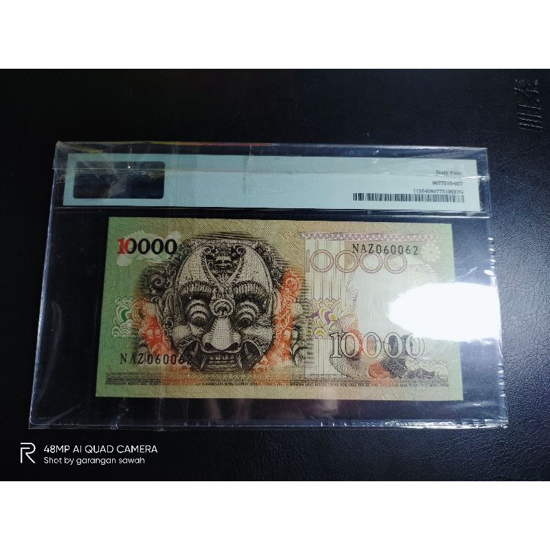 uang kuno 10000 barong PMG 64
