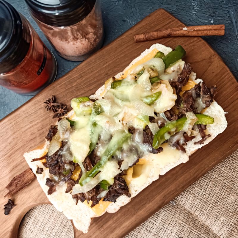 

Philly Cheesesteak Sandwich Slow Cooked in Broth