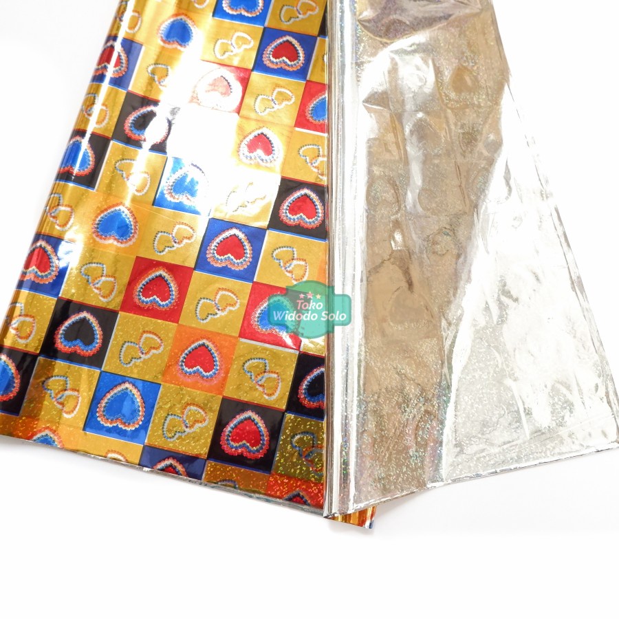 

Plastik Kado Hologram Emas Hati 50x65cm - 10 Lembar